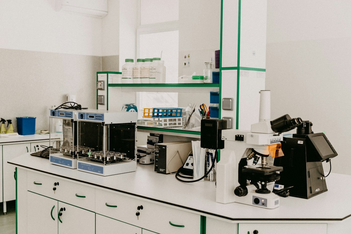 A laboratory bench with a microscope and analytical equipment